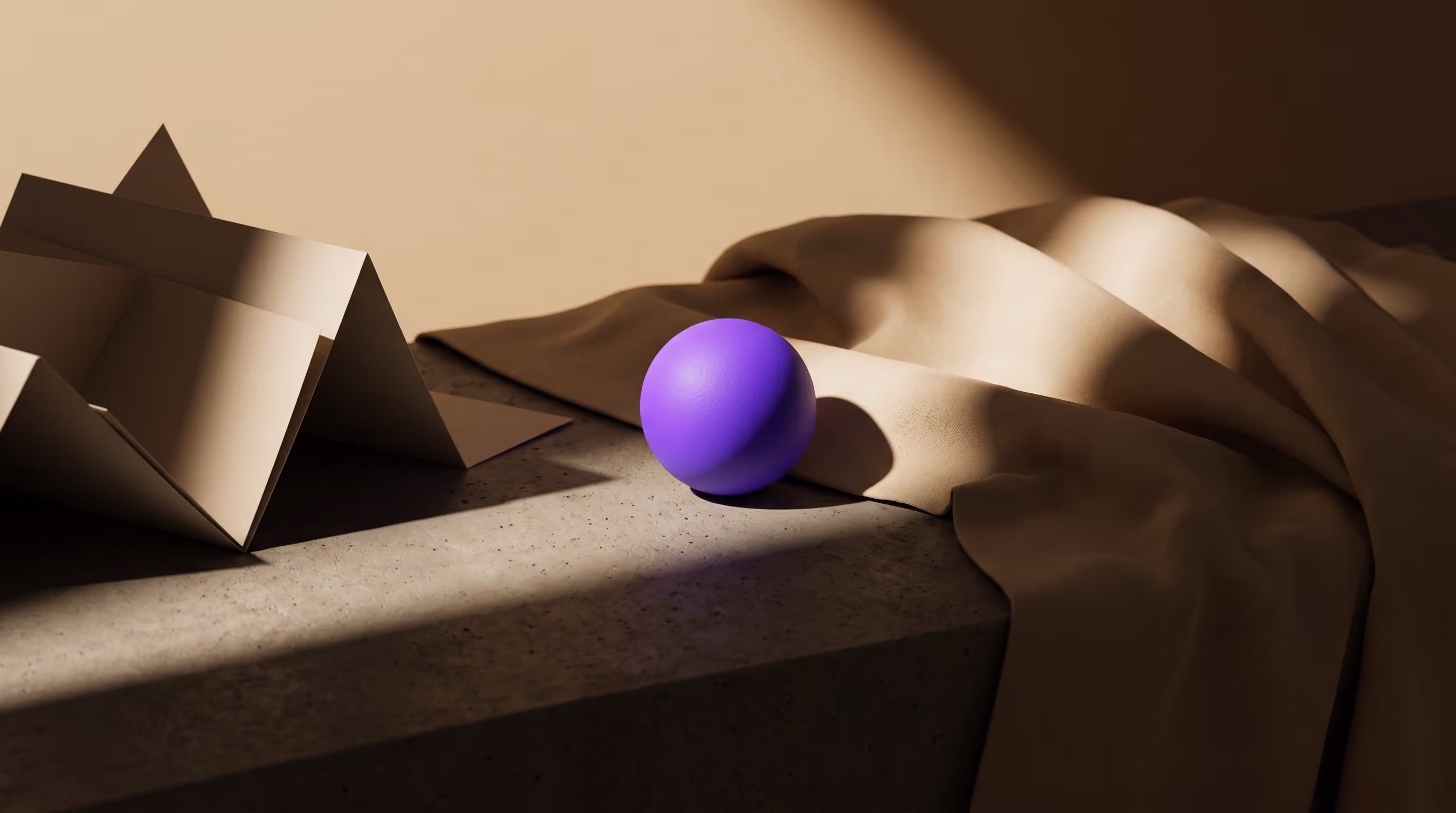 A bright purple sphere lit by a single dramatic shaft of directional light beside folded paper and soft draped fabric on concrete, representing one hero object staged to catch the perfect light.